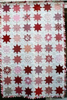 Rote rosa Stern-Quilt-Muster